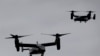 FILE - US Marine Corps V-22 Osprey aircraft approach for landing in New York, Sept. 25, 2014.