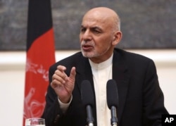 FILE - Afghan President Ashraf Ghani speaks during a press conference in Kabul.
