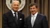 Turkish Foreign Minister Ahmet Davutoglu (R) and his French counterpart Laurent Fabius shake hands after a news conference in Ankara August 17, 2012.