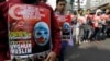Muslim protesters hold banners during a rally outside China's embassy in Jakarta, Indonesia, Friday, Dec. 21, 2018. 