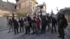 Members of the Jund Allah Brigades, part of the Free Syrian Army, hold their weapons as they pose for a photograph in Deir al-Zor, eastern Syria February 18, 2014. Picture taken February 18, 2014.