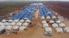 FILE - An aerial view taken on Feb. 22, 2020 shows a newly-created camp for internally displaced people (IDP) near the town of Maarrat Misrin in Syria's Idlib province. 