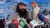 FILE - Syed Salahuddin, Supreme commander of Hizbul Mujahideen whose militants are fighting in Indian Kashmir against the Indian army, addresses his supporters in Muzaffarabad capital of Pakistan's administered Kashmir, July 13, 2011. 