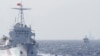 FILE - Ships of Chinese Coast Guard are seen near Chinese oil rig Haiyang Shi You 981 in the South China Sea, about 210 km (130 miles) off shore of Vietnam.