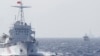 FILE - Ships of Chinese Coast Guard are seen near Chinese oil rig Haiyang Shi You 981 in the South China Sea, about 210 km (130 miles) off shore of Vietnam.