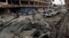 FILE - An Afghan policeman inspects the site of a blast near the Indian consulate in Jalalabad, Afghanistan, March 2, 2016. Security forces killed the suicide bombers who targeted the building.