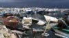 Des épaves de bateaux utilisés par les migrants échouées le long du port d'El-Amra, en Tunisie, 24 avril 2024. Fethi Belaid / AFP