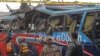 Pakistani security personnel examine a bus following a bomb blast in Peshawar, Pakistan, Wednesday, March 16, 2016.
