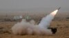 FILE - A surface-to-air missile is launched during exercise 'Iron Fist' at Pokhran, India, March 18, 2016. 