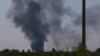 Ukraina vertolyoti urib tushirilishi oqibatida paydo bo'lgan qora tutun, 29-may, 2014-yil.