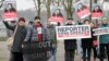 FILE- Members of Journalists Without Borders protest against Azerbaijan's President Ilham Aliyev in Berlin, January 2015. 