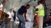 UN workers unload disputed ballot boxes from a FILE - UN helicopter at Kabul International Airport before being transferred to the Independent Elections Commission (IEC) warehouse for auditing, in Kabul, Afghanistan.