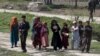 Afghan children hold the holy Koran as they go to a madrasa (religious school) in Dand Ghori district in Baghlan province, Afghanistan, March 15, 2016. 