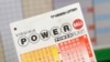 A man holds the tickets he purchased for Virginia's $400 million Powerball lottery in Arlington, Virginia February 19, 2014.