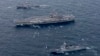FILE - The Navy's forward-deployed aircraft carrier USS Ronald Reagan, center, and the forward-deployed Arleigh Burke-class destroyer USS Stethem, left, steam alongside ships from the South Korean navy during joint naval drills, Oct. 18, 2017, east of the Korean Peninsula.