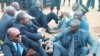  En lunettes noires, Sosthène Médard Lipot, Conseiller du Président du Mouvement pour la renaissance du Cameroun, le 29 mars 2016, lors d'une intervention musclée des forces de l'ordre venues interdire une conférence de presse au siège du MRC, le 6 mars 2