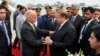 Pakistani Prime Minister Nawaz Sharif, center right, greets Afghan President Ashraf Ghani, center left, upon his arrival at Nur Khan airbase in Rawalpindi, Pakistan, Dec. 9, 2015. 