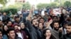 Protesters shout slogans during a protest against the Citizenship Amendment Bill, that seeks to give citizenship to religious minorities persecuted in neighboring Muslim countries, inside amia Millia Islamia University in New Delhi, India, Dec. 14, 2019.