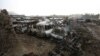Destroyed cars are seen on the ground after yesterday's Taliban-claimed deadly suicide attack in Kabul, Afghanistan, April 20, 2016.