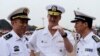 Robert L. Thomas Jr. (C), Commander of the U.S. Seventh Fleet talks with Chinese general Yuan Yubo (L) at a port in Qingdao, during the U.S. Seventh Fleet Flagship USS Blue Ridge (LCC 19) visit to China, Shandong province, August 5, 2014.