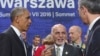 Afghan President Ashraf Ghani, center, speaks with U.S. President Barack Obama and NATO Secretary General Jens Stoltenberg at the NATO summit in Warsaw, Poland, July 9, 2016.