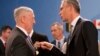 U.S. Defense Secretary Jim Mattis, left, speaks with NATO Secretary General Jens Stoltenberg during a meeting of NATO defense ministers at NATO headquarters in Brussels, June 29, 2017.
