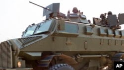 Uganda People's Defense Force pass through Bor in Jonglei State in mid-January. Uganda insists their presence assured the security of Ugandan citizens and humanitarian services in the two-month internal conflict. 