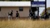 Law enforcement officials investigate the scene of a shooting at the First Baptist Church of Sutherland Springs, Nov. 6, 2017, in Sutherland Springs, Texas. 