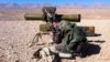 A pro regime soldier aims a rocket launcher towards rebel locations in the Qalamoun region on the outskirts of the Syrian capital Damascus on February 13, 2014. 