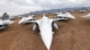 FILE - F-16 Fighting Falcons sit in a field at Davis-Monthan Air Force Base in Tucson, Arizona, May 21, 2015.