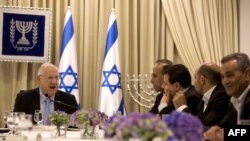Israeli President Reuven Rivlin, left, speaks during consultations with representatives of the Joint List, right, an alliance of four small Arab-backed parties, Jerusalem, March 22, 2015.
