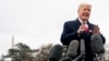 FILE - President Donald Trump speaks to reporters before boarding Marine One on the South Lawn of the White House in Washington, Nov. 26, 2018.