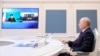 FILE - Russian President Vladimir Putin signs an agreement on railway construction with Iranian President Ebrahim Raisi via videoconference from Moscow on May 17, 2023. Russian officials said on Aug. 26, 2023, that its military ties to Iran will survive pressure from the U.S.