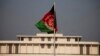 FILE - Afghanistan's flag is seen hoisted before the President House in Islamabad, Pakistan, Nov. 13, 2014, ahead of Afghan President Ashraf Ghani's first state visit to neighboring Pakistan.