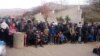 Syrians wait for the arrival of an aid convoy, Jan. 11, 2016, in the besieged town of Madaya as part of a landmark six-month deal reached in September for an end to hostilities in those areas in exchange for humanitarian assistance.