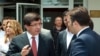 Turkish Foreign Minister Ahmet Davutoglu talking to an adviser, in Ankara, June 24, 2012, in this image made available by the Turkish Foreign Ministry. 