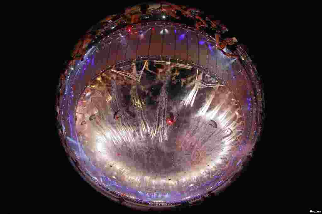 Fireworks are seen through a fish eye lens during the closing ceremony of the London 2012 Olympic Games at the Olympic Stadium, August 12, 2012.