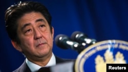 Japanese Prime Minister Shinzo Abe speaks at a news conference in New York, Sept. 27, 2013. 