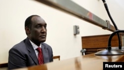 Exiled Rwandan General Faustin Kayumba Nyamwasa looks on during his court appearance in Johannesburg, June 21 2012. 