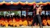 Cambodian students re-enact torture executed by the Khmer Rouge to mark the annual "Day of Anger" at Choeung Ek, 20 May, file photo. 