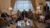 Members of Afghanistan's High Peace Council talk with delegates (not pictured) from the Hezb-e-Islami group, during a meeting in Kabul, March 17, 2016.