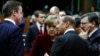 Britain's Prime Minister David Cameron (L-R), Germany's Chancellor Angela Merkel, Romania's President Traian Basescu and European Commission President Jose Manuel Barroso attend a European leaders emergency summit on Ukraine, March 6, 2013.