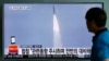 FILE - In this May 31, 2016, file photo, a man watches a TV news program reporting about a missile launch of North Korea, at the Seoul Train Station in Seoul, South Korea.