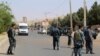 FILE - Afghan police soldiers inspect the site of a bomb attack, in Herat, Afghanistan, Saturday, July 30, 2016. 