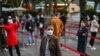 People wait in line to get tested for the coronavirus, in Jing'an district, Shanghai, China, Oct. 25, 2022.
