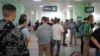 Russian men line up to register at a public service center in Almaty, Kazakhstan, Sept. 27, 2022. After President Vladimir Putin ordered a partial mobilization to bolster his troops in Ukraine, many Russians are leaving their country. (Vladimir Tretyakov//NUR.KZ via AP)