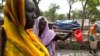 Women gather to collect water at the Yusuf Batil refugee camp in Upper Nile, South Sudan, July 4, 2012.