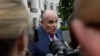 FILE - President Donald Trump's lawyer Rudy Giuliani speaks to reporters on the South Lawn of the White House in Washington, May 30, 2018.