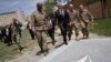 U.S. Defense Secretary James Mattis, third right, walks with U.S. Army Command Sergeant Major David Clark, left, and General Christopher Haas, second right, as he arrives to the Resolute Support headquarters in Kabul, Afghanistan, April 24, 2017. 