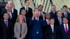 Romanian Foreign Minister Teodor-Viorel Melescanu, center, stands with European Union foreign policy chief Federica Mogherini, second left, and Singapore's Foreign Minister Vivian Balakrishnan, left, during a group photo at an EU ASEAN meeting, Brussels, Monday, Jan. 21, 2019. 